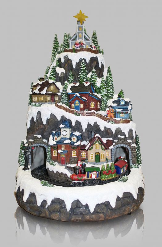 villaggio natalizio su montagna innevata con treno in movimento, luci, musica (32,5 x 50 x 31 cm)