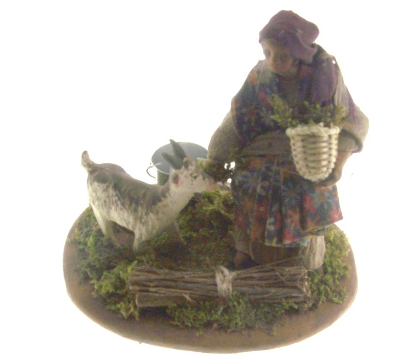 donna che nutre capra cm 12 terracotta