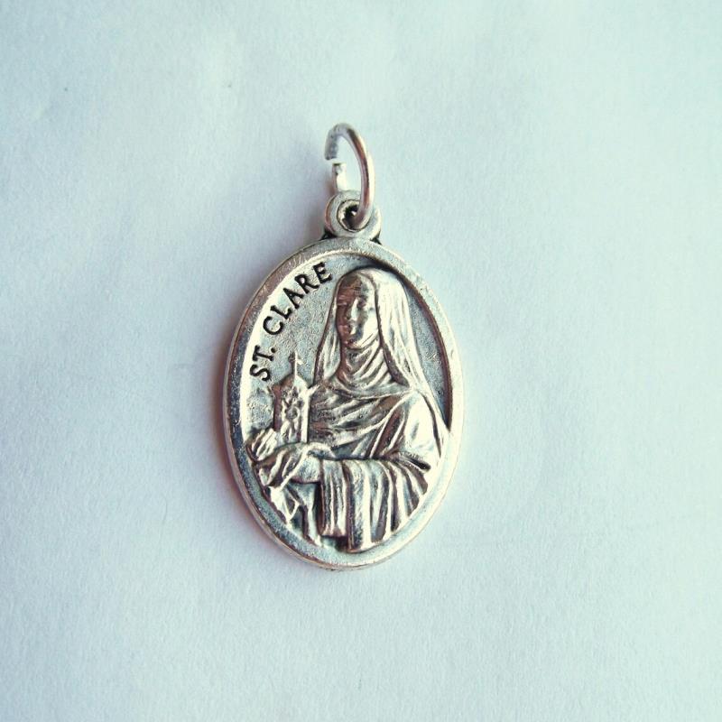 medaglia ovale cm 2,2 con anello metallo ossidato santa chiara