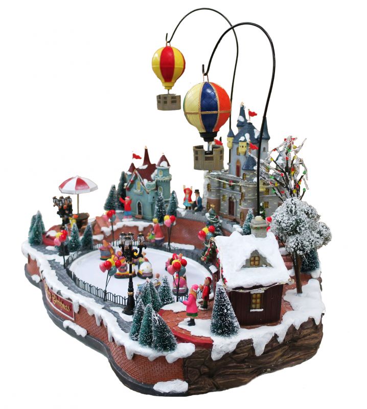 villaggio natalizio con pista di pattinaggio e mongolfiere in movimento, luci, musica (65 x 49 x 49 cm)