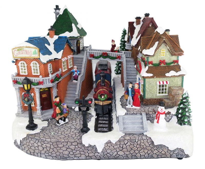 villaggio natalizio stazione ferroviaria con treno in movimento, luci, musica (25 x 34 x 26 cm)