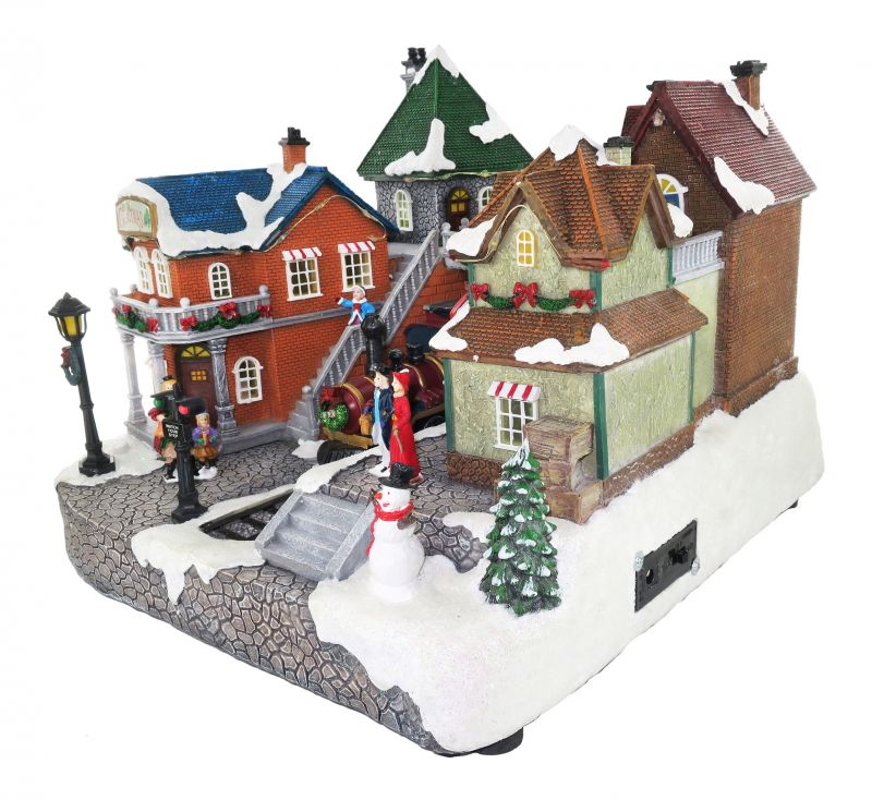 villaggio natalizio stazione ferroviaria con treno in movimento, luci, musica (25 x 34 x 26 cm)