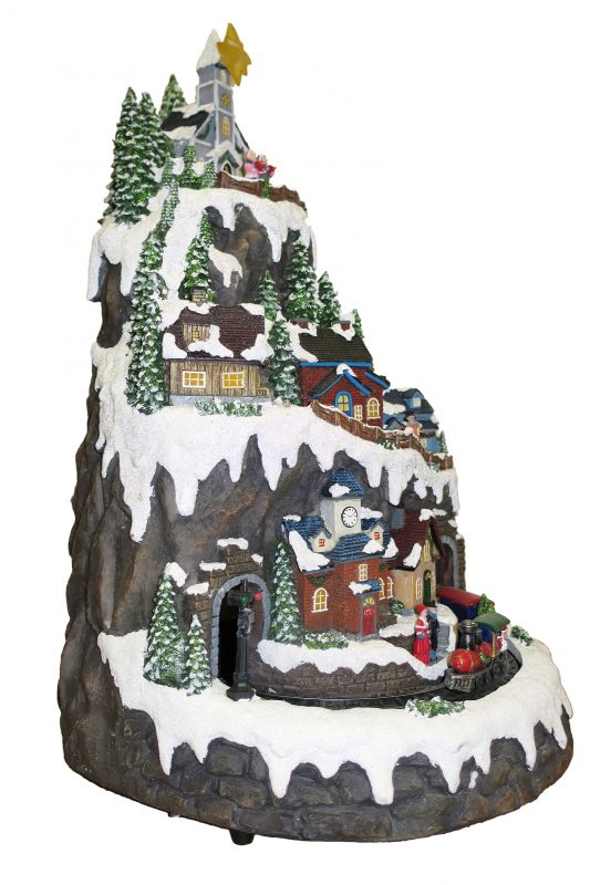 villaggio natalizio su montagna innevata con treno in movimento, luci, musica (32,5 x 50 x 31 cm)
