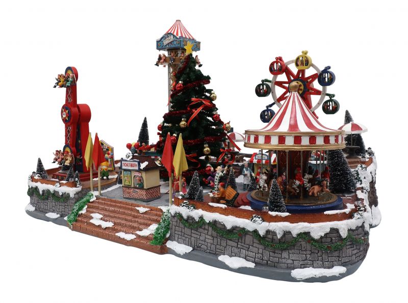 villaggio di natale con luna park, albero di natale e giostre, con movimento, luci e musica